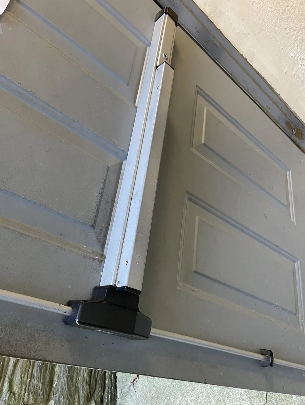 Panic bar exit device installed on a commercial exterior door